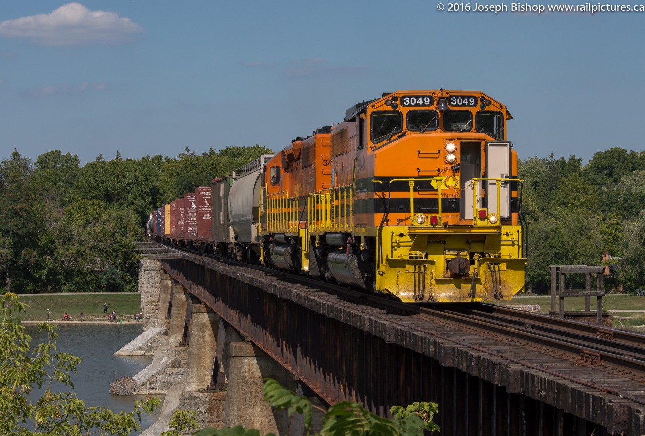 RLHH 3049 leads a very late 597 through Caledonia and across the Grand River.  The crew ended up running out of hours in Brantford for some reason last night (presumably there were a lot of CN trains on the Dundas Sub).  This made for a nice Labour Day treat.