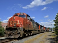 CN X321 (with overflow trafffic from Southwark yard) rounds a curve in St-Henri with CN 2275, CN 8878 & CN 8010 for power.