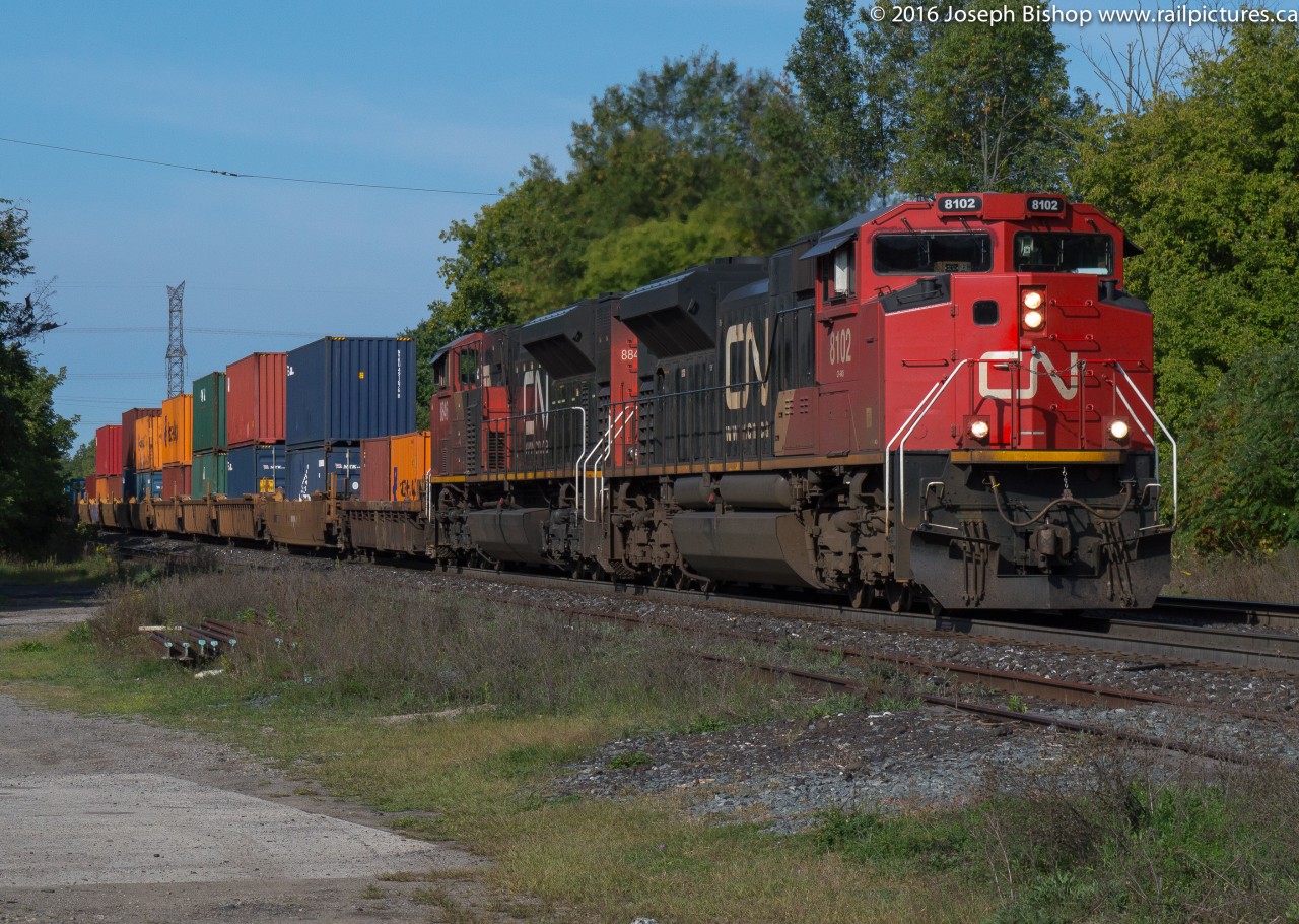 CN Q148 is lead downgrade through Copetown by CN 8102, one of four ex EMD Demonstrator SD70Ace's on the CN roster.