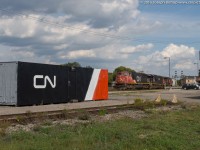 CN 435 arrives at Brantford with CN 5757 IC 1021 CN 2099.  They are passing the freshly painted CN container located alongside the Brantford Yard.  The container was painted by CN maintainer Brad Jones and it really cleans up and adds some class and pride to the location.  Well done!
