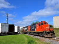 <b>An obscure industrial spur.</b> CN 564 with a pair of GP9's (CN 7083 & CN 4139) is heading light towards the end of an obscure industrial spur in Montreal (the St-François Spur, which branches off the Doney Spur) to pick up some plastic pellet cars. 