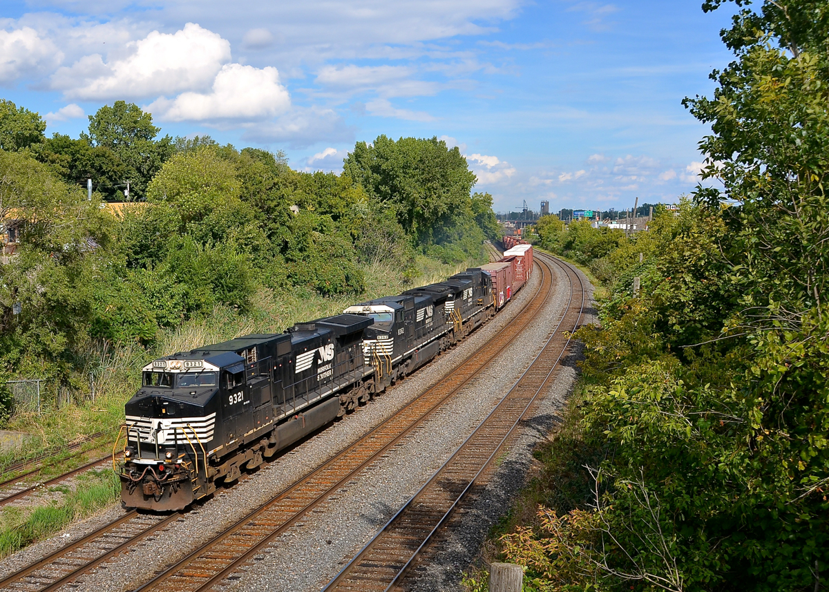 Sunny, but barely. CN 529 with three NS units (NS 9321, NS 8362 & NS 8886) is through Montreal West with 76 cars, comprising cars from both CN 529 as well as CN 323. The sun would start to disappear about half a second after I took this shot.