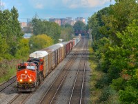 CN 2228 & CN 2677 lead CN 401 towards nearby Taschereau Yard where this train from Joffre will terminate.