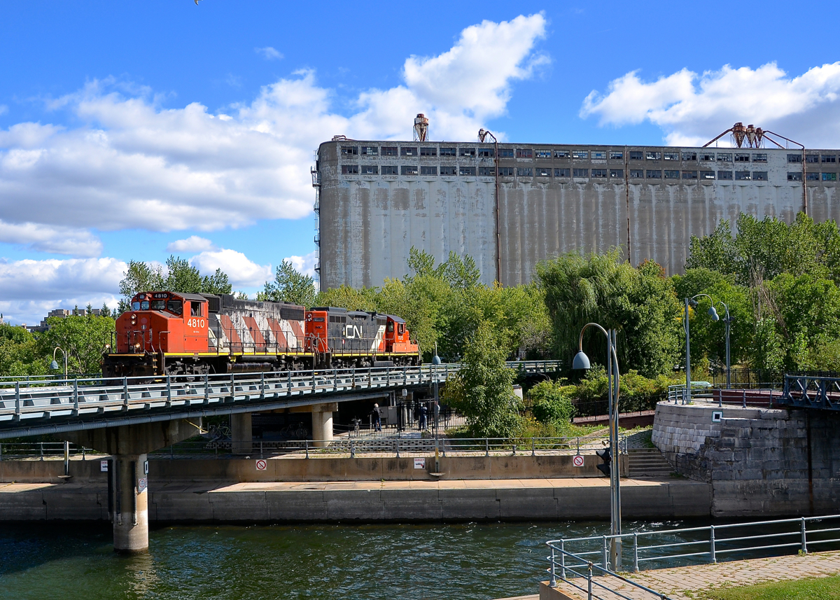 Stopped. CN 4810 & CN 7075 are stopped before heading light into the Port of Montreal to pick up some cars as they await Port of Montreal security to arrive and flag the first crossing.