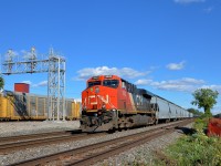 <b>Westbounds on both railways.</b> CN 377 is westbound through Dorval on CN's Montreal Sub (becoming the Kingston Sub shortly) just a few minutes after CP 119 (seen at left) passed on the parallel CP Vaudreuil Sub.