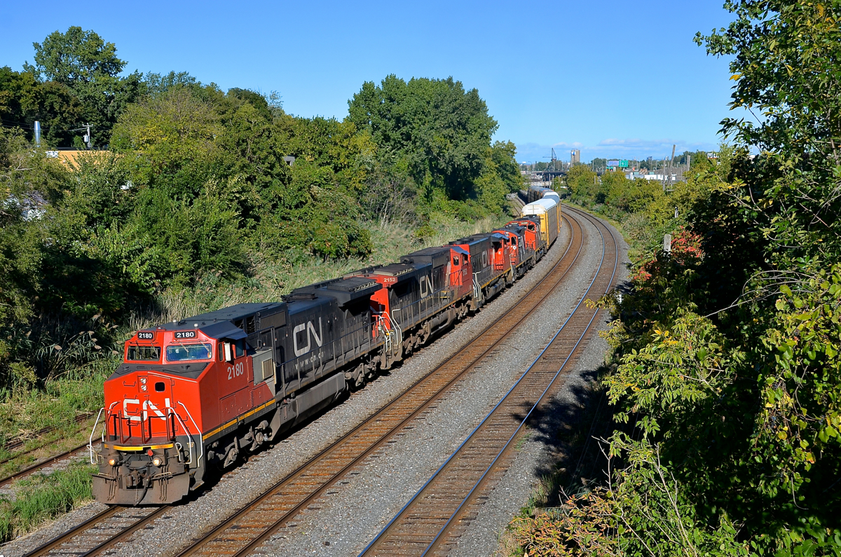 Older power. CN 401 has a pair of ex-ATSF Dash8-40CW's followed by a trio of geeps (CN 2180, CN 2152, CN 9450, CN 4140 & CN 9486) as it heads through Montreal West on a gorgeous fall afternoon. No new power here, the combined age of these 5 units is 182 years old!