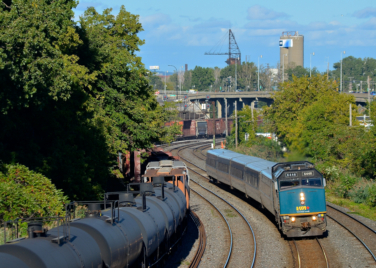 Zooming past a slow freight train. VIA 69 is on the north track of CN's Montreal Sub as it zooms by local transfer CN 527, which is slowly heading west as well on the transfer track.
