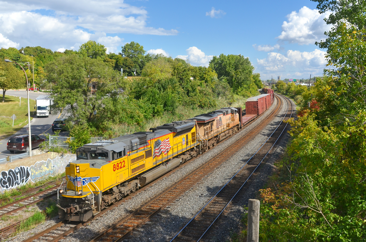 Two different shades of armour yellow. In a break from the usual black NS power, CN 529 has a pair of UP units as it heads through Montreal West with a short train. Leading is fairly fresh SD70Ace UP 8822 (built in 2013) while the older trailing unit (ES44AC UP 5335, built in 2006) has a much more faded version of the classic armour yellow paint scheme.