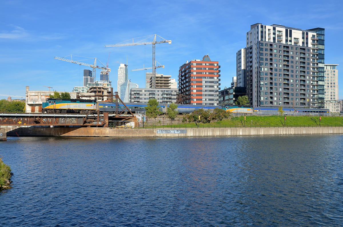 VIA 605 for Jonquière and VIA 607 for Senneterre are lashed up together with VIA 605 first as it passes the Peel Basin five minutes after leaving Central Station in Montreal. Both trains feature an F40, a coach and a baggage car, though not in that same order. Power is VIA 6436 on 605 and VIA 6433 on 607.