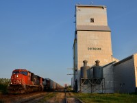 <b>A classic Prairies location.</b> A pair of SD75I's (CN 5735 & CN 5636) lead Chicago-Prince Rupert CN 347 past the elevator at Dufresne, Manitoba on CN's Sprague Sub, just a bit east of Winnipeg.