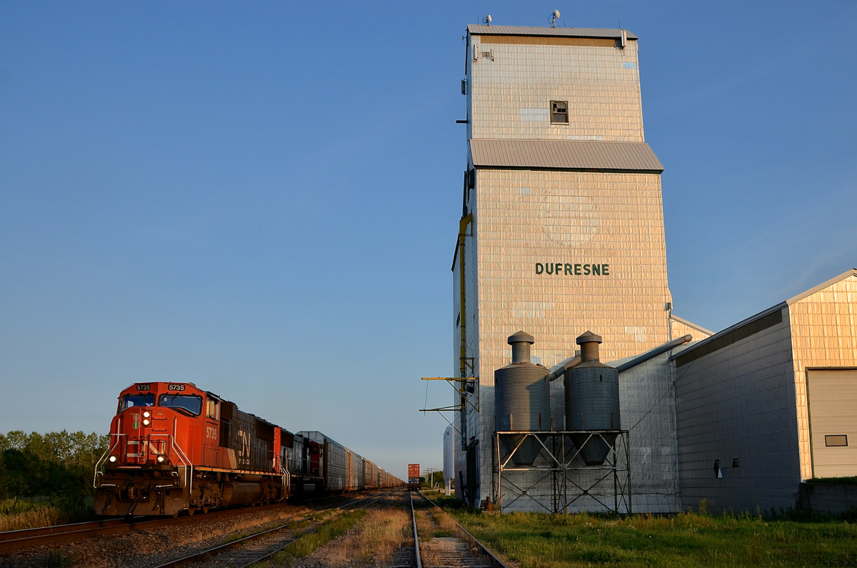 A classic Prairies location. A pair of SD75I's (CN 5735 & CN 5636) lead Chicago-Prince Rupert CN 347 past the elevator at Dufresne, Manitoba on CN's Sprague Sub, just a bit east of Winnipeg.