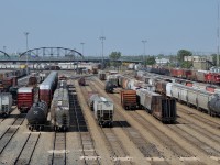 A pair of GP38-2's switch in the distance at right in CP's massive Weston Yard in Winnipeg.
