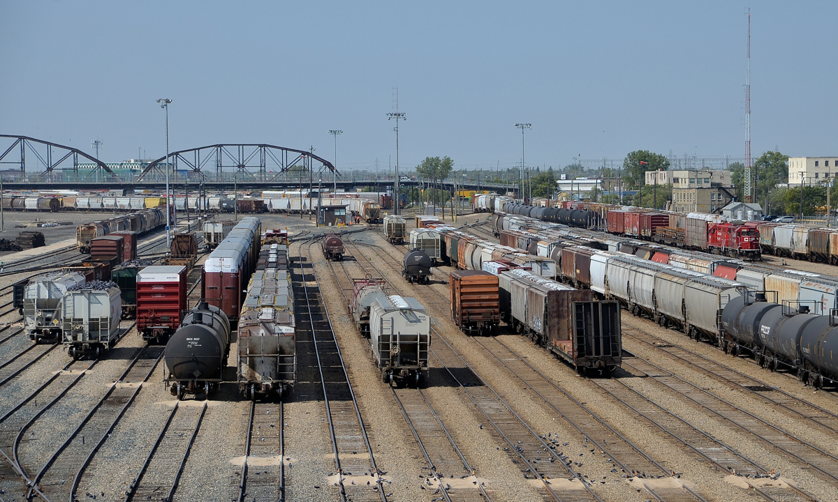 A pair of GP38-2's switch in the distance at right in CP's massive Weston Yard in Winnipeg.