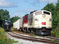 OSRX 6508 and 1620 have left most of their train east of the connection track to CN, and are heading west with five covered hoppers that they lifted in Beachville and will soon drop them at the customer in Putnam. 
