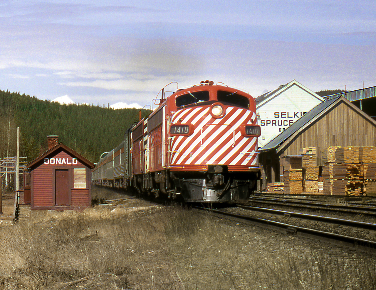 The eastbound "Canadian" passes the shelter station and sawmill at Donald BC just west of Golden