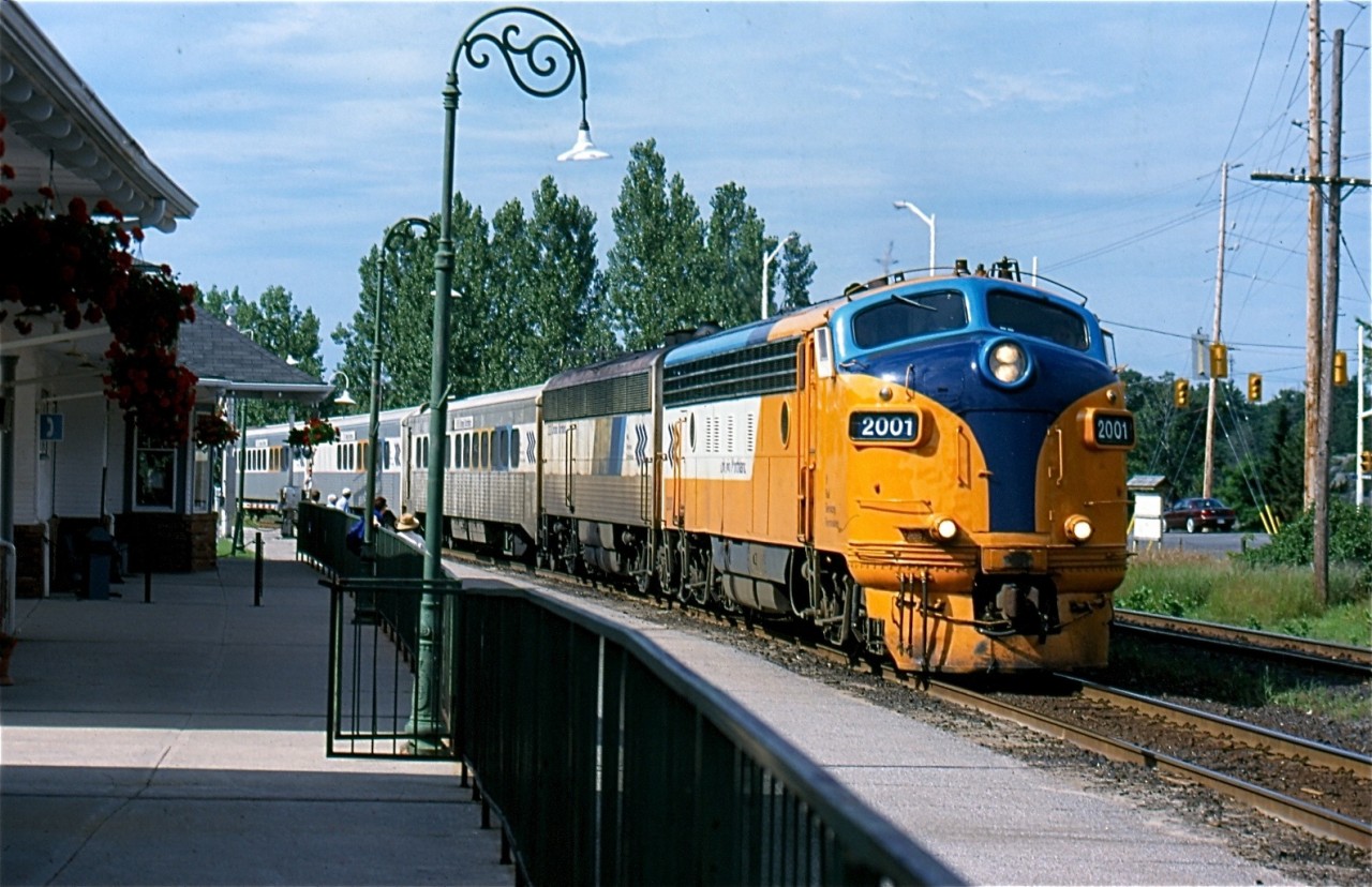 The southbound "Northlander" is seen pulling into Gravenhurst station after a near miss with a car at the crossing in the background. CAT powered "F" unit #2001 is in charge of today train. Sadly these days not only are the "F" units history but the "Northlander" as well, and the station here is currently only used as a bus depot.