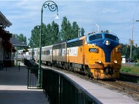 The southbound "Northlander" is seen pulling into Gravenhurst station after a near miss with a car at the crossing in the background. CAT powered "F" unit #2001 is in charge of today train. Sadly these days not only are the "F" units history but the "Northlander" as well, and the station here is currently only used as a bus depot.
