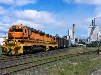 Huron Central's Espanola turn is seen working the large paper mill at Espanola. This is the last industry using rail service on the Little Current subdivision, one time Algoma Eastern. While the majority of this line was still intact back in 2001 today almost all of it is gone. The SD45s and GP9s are also gone today as well, replaced by GP40s and other four axle units.