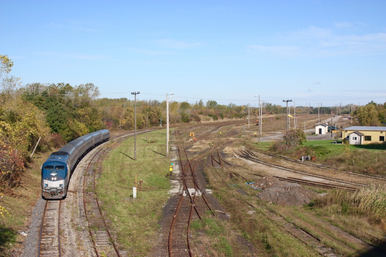 This shot is a comparison to my shot from 1997. Here we see VIA / Amtrak train 97 passing the sad remains of CN's Niagara Falls yard in 2011. A crew can be seen busy dismantling the yard tracks. Today all that remains is a field of weeds.