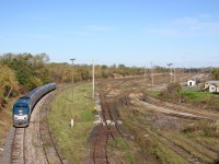 This shot is a comparison to my shot from 1997. Here we see VIA / Amtrak train 97 passing the sad remains of CN's Niagara Falls yard in 2011. A crew can be seen busy dismantling the yard tracks. Today all that remains is a field of weeds.