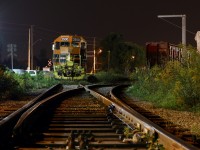 Silent Steel. The early morning hours finds local train 582 power slumbering the hours away beside the locals busiest customer, a lumber yard located in Cambridge. The lumber yard is active day and night, and Quebec Gatineau GP35 #2500 will be called upon in the morning to haul the empty centre beam lumber cars back up to the mainline in Guelph where local #580 will later in the day forward them to Kitchener for lifting the next day by road train #432 and on to CN's yard in Toronto. At one time the Fergus subdivision extended from CN's Dundas sub at Lynden all the way to the division point of Palmerston. Today it only extends between Cambridge and Guelph, no longer traveling through its namesake town of Fergus.