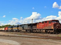 Here we find a trio of SD40's making their way to Toronto on Eastbound CP 242 through Guelph Junction. Leading the 6500+ train is CP 9755 with CEFX 1028 for power. Taking the ride are ICE 6211 (SD40-2), DME 6076 (SD40-3), still in nice blue and yellow, and DME 6092 (SD40-3) in faded CP red.












