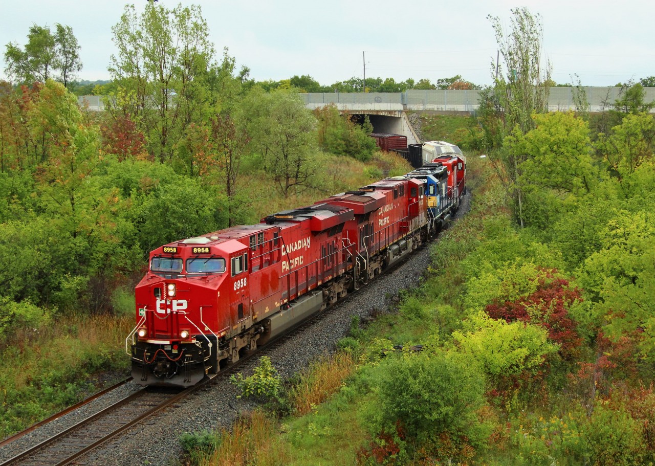 As is typical, some of the best trains come in the rain and todays CP 246 was no exception. Having just got CP 143 at Guelph Junction in the pouring rain, I was ready to go home and call it a day when CP 246 got clearance down the hill. I thought I may as well wait for it, so I moved to my old faithful 1st line so I could shoot it out the window. CP 8958 was leading CP 8832 and ICE 6102 (SD40-3 with STL&H 5615 (SD40-2) along for the ride. I didn't get a good shot of all 4 locomotives, so I got this shot at Newman Rd. The rain was cooperative for a few minutes here and stopped.
