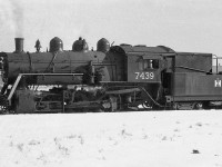Ex-Canadian National 0-6-0 7439 (O-18-a class, nee-GTR) switches the International Harvester plant in Hamilton in 1960. Sold to IHC in 1958, it was apparently scrapped 3 years later in 1961. Only two other CNR O-18's fared better, 7456 and 7470 which were sold to <a href=http://www.railpictures.ca/?attachment_id=25982><b>Canada and Dominion Sugar (Redpath)</b></a> for plant switching.<br><br>International Harvester Company of Canada (later Case IH) owned a few small steam and diesel locomotives over the years to switch its Hamilton plant trackage, including ex-TH&B 0-6-0 43 that was operated prior to 7439 arriving, and ex-Erie Lackawanna Alco S1 308 acquired in 1968 (that later went to Trillium).