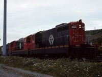AMONG THE LAST - Terra Transport Extra 936 West with three units prepares to depart the St. John's Yard for Port aux Basques on the grey evening of July 28, 1988. Knowing that time was quickly running out for the Newfoundland operations, this was the among the very last full length revenue trains to operate westbound and the very last to be captured by the photographer. Despite the pristine condition of the NF210's, within eight weeks they would be shut down for good on the Island, with lead 936 being preserved at Avondale, 941 sold to F.C. del Pacifico of Nicaragua and 919 being scrapped.