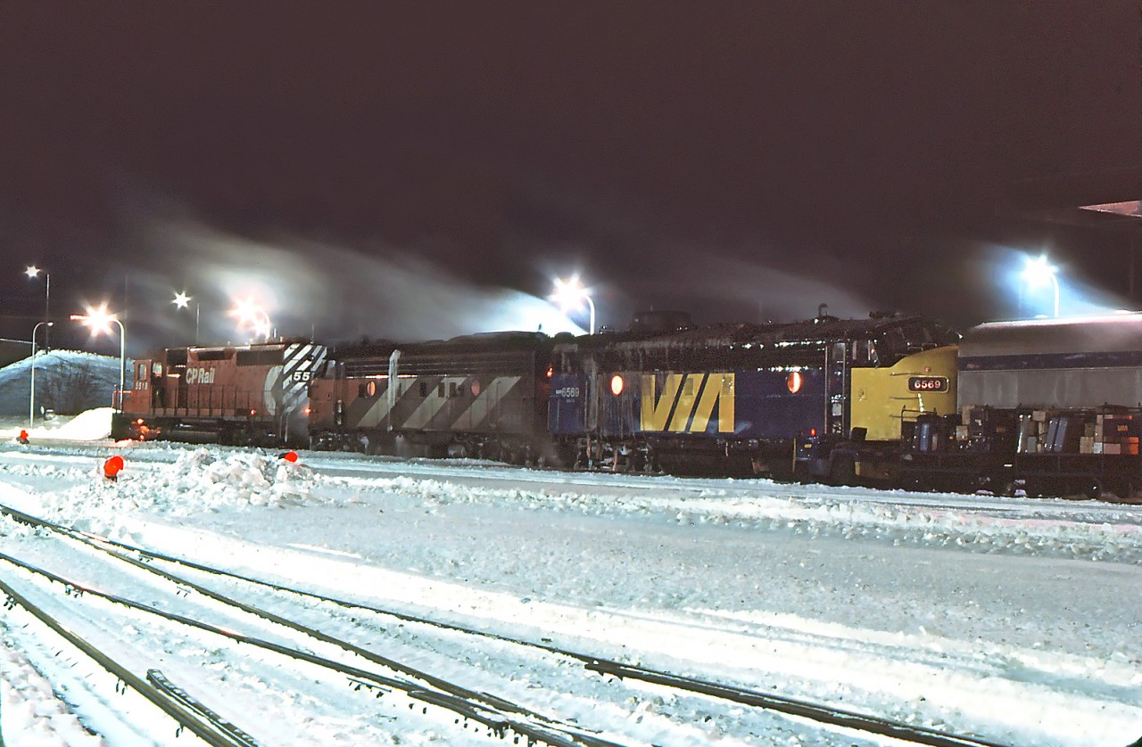 A few weeks ago I posted Ian Walker's front 3/4 photo of this train. Here, thanks to the magic of Dan Dell'Unto, is a side view. It's a chilly night in January 1981 and one of the F units on the Canadian has failed. CP SD-40 5519 has been called in to assist VIA 6536 (still in CN paint) and VIA 6569 (ex CP 1425).
Thanks for sharing, Ian. Judging by baggage to be handled, business must be good.