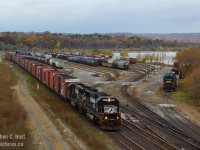 <b>Back to my oldies</b> yeah, not that long ago.. but a pair of EMD SD60's lead Norfolk Southern's St. Thomas, Ontario to Buffalo, NY train 328 at Hamilton, long before the thought of a new GO station that completely obliterated the scene you see here. This was six months after getting my Digital SLR and I was well on my way to learn how to compose a passable image. Trust me, there were mistakes, but little gems like this make it all worthwhile. While only two years remained for NS trains into Ontario - NS H3R (Buffalo NY to Fort Erie, ON) continues to this very day with the same St. Thomas based (Wabash) crews. Youngins are advised to head to Fort Erie to get it while you can - your time machine awaits!
