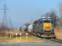 CSXT's Daily transfer from CN is almost at home rails, about to cross Highway 40 in Sarnia. It's nice to see air conditioning on yard units, a rare amenity for railway crews, but it was quite cold on this day despite the lack of snow.