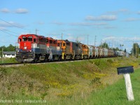 Running late - at 17:30 431 is running west of Acton at 37.2 with a gaggle of all EMD motive power in notch 8  - this sounded really good, but it wasn't a great day for the crew. <br><br>What follows is a  bit of a story - this explains, in my words, how a part of GEXR operates today and to a point why they do what they do. Comments/corrections very welcome and will update to reflect changes, concluding with the photo you see above.<br><br><b>Goderich-Exeter Railway</b>. When 432/1 used to be a CN operation, 432 would call at London and run to Toronto, 431 would call at Mac Yard and terminate at London and both trains would meet en-route. This meant a two trains each with three (or four) man crews. When GEXR took over in 1998 the aim is to make the operation more efficient. You can easily say this is true but the truth is 432/1 run one of the most razor thin and daring 176 mile round trip operations on the road today. They now often accomplish all of what CN did with six to eight men, with little to no spare motive power, with only two men on a daily basis. Except for when things go wrong. Here's why:<br><br>432/1 is ordered Daily, Stratford to Mac yard turn at 0500. After making their train in Stratford yard, they head to Kitchener, where they most often have a lift of some traffic for Toronto. On weekdays, it's highly possible 432 has to wait for a GO train to exit the block before access to Kitchener yard can be granted, and after all the work is said and done GEXR 432 departs Kitchener about 0830 and is usually through Guelph at 0900. There is sometimes work at Shantz (P&H Elevator) or at Guelph but this is rare - never is any work east of Guelph so it's usually a straight shot ex Kitchener - but then you enter CN territory. Will there be congestion? Will CN have the outbound lift at mac ready on time? You see GEXR 432/1's average round trip already takes about 10 hours end to end, and crews have maximum 12 hours before being dead on the law - which means train must be parked, period, wherever it is at the 12 hour mark. Hence there is about 1 to 2 hours of delay time in total that GEXR can afford. This is a razor thin margin for a 176 mile round trip. For example if they don't exit mac by about 1330-1430 - the standard operating procedure is to kill the train at mac and rescue it the next day. Otherwise, they run the significant risk of dying on CN or in the single track between Silver and Kitchener  - which would block the 4 GO trains and VIA's that now ply the line.  If this happens, scratch the afternoon 431 and  next morning 432 from your TODO list since GEXR will just wait to send the next day's 432 in a taxi to Toronto from Straford - and this happens much more often than you think - probably once a week, again due to variables out of GEXR's control. Phew. So let's assume that it's about 1330-1400 -  and it's decision time - a good hogger will offer to take the train to Kitchener - the next possible place to park the train ex Mac yard -  assuming they are able to assess the tonnage and motive power situation to assault the biggest obstacle for westbounds, <b>Acton Hill</b>. This is the one variable that can be very difficult to predict, with temperamental and ageing motive power, anything happens when you are in full throttle assaulting a 1% grade (334 foot rise over 7 miles.<br><br>Today, September 11 2016, 432 was through Guelph at 9:30 AM (a bit late due to being stabbed at Waterloo St. by an Extra GO move ex Kitchener) with 19 cars but in the afternoon GEXR 431 left mac with 73 cars, 4140 feet of train with 3393/3054/3394 for power at a time of about 1330 - made good time out of mac. But for some reason that I have not yet found out, the train lost their light at Norval - train had to come to a complete stop. I managed to catch up at Georgetown, and they passed Georgetown at 20-25 MPH but I am going to assume that the crew didn't have enough momentum for the hill after stopping at Norval and as a result stalled on the grade. <br><br>This brings us to the next stage - the way I see it the critical decision on GEXR is whether or not to leave mac yard. If they do decide to leave mac, there better be rescue power and a rescue crew available if needed. If there isn't - they now stand to be in the way of a lot of passenger trains on a weekday, and 87 on a weekend. Of course, today, after stalling there was a rescue called, and within 2 hours, light power from Kitchener had made it to Limehouse, and within 10 minutes of arriving the boys are back on their way. So you have the photo above - what I assume is GEXR x518 (extra puller crew) and 431 running together out of Acton, at 1730, almost out of the grade with the spedometer reading 45 MPH as they climb slowly to track speed of 50-60 MPH.<br><br> This sounded very good but not a great day for the boys in the cab. GEXR always gets the job done though and the razor thin margin of error is well protected. When you think about it the true hero in all of this is the hogger - there are times where miracles happen and a train that should stall gets over the grade on time - but do we notice these occurrences? Nope - because operations seem normal. We as railfans tend to notice the abnormal. Bottom line though for the 'fans - roll the dice if you are going to the GEXR mainline, you just don't know what's going to happen. <br><br>Corrections/comments highly welcome and will update as required.