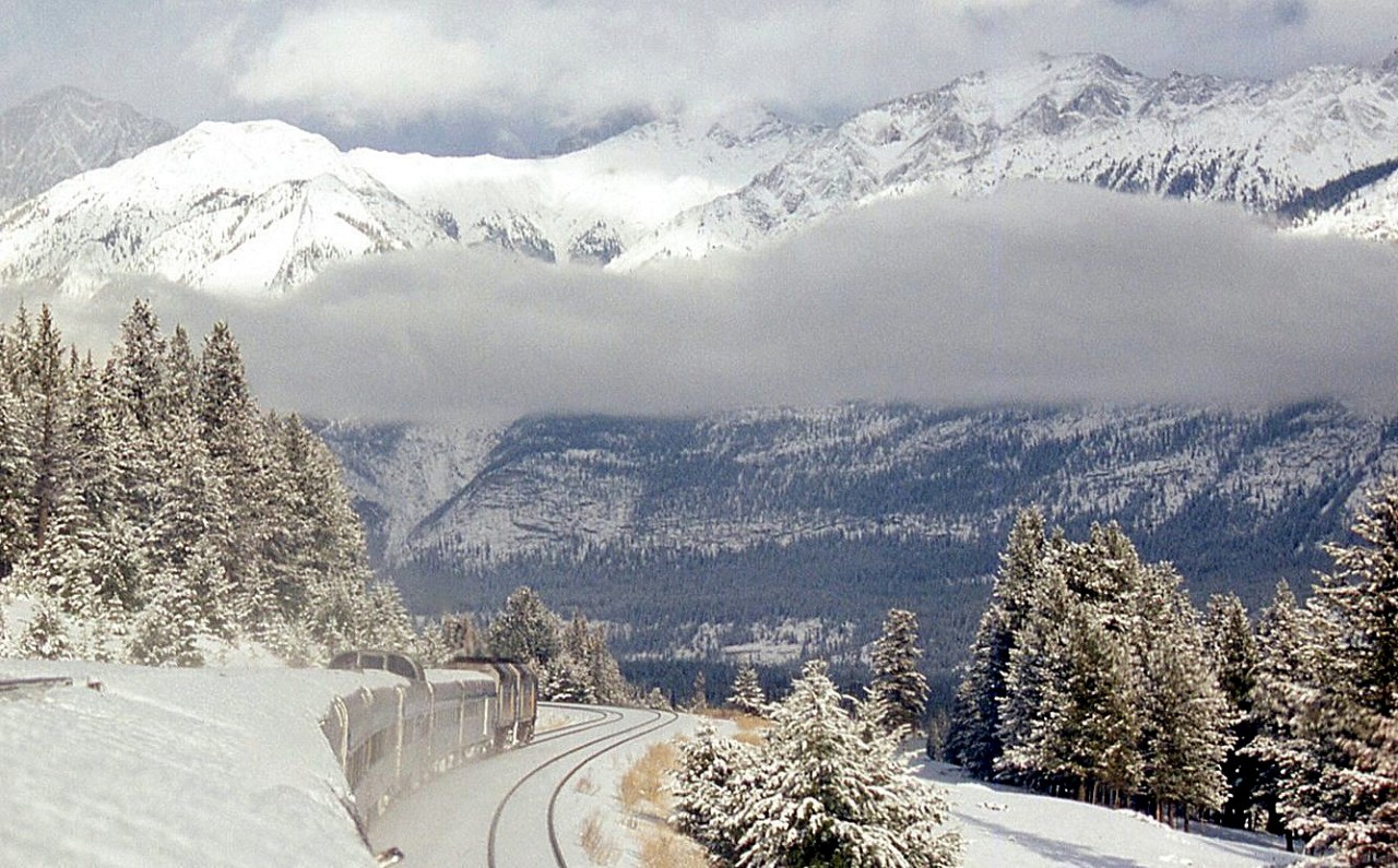The snowy mountain ranges fill the view from the dome car as VIA #2, the Canadian, heads east near Jasper.

Note, geotagged location not exact