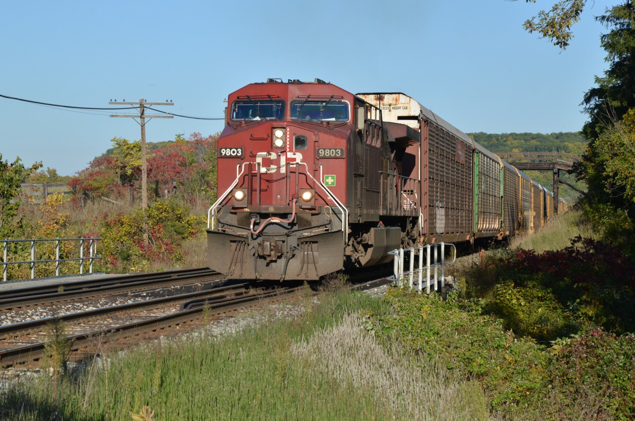 CP 9803, is on a solo mission, charging upgrade and westbound with a long train comprised of autoracks.  Like Kevin Flood, I suspect this was the 1st of two CP 147's less than 30 minutes apart.  Friday was another PD day for me, excellent conditions and opportune time to revisit Campbellville and its classic rail-fanning spot ... escarpment, private wooden bridge, rail type fence, track grade and enhanced by a timely touch of fall colouring.