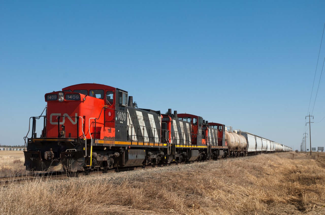CN 1409,1421 and 1406 are in the process of making a large shove from the industries of Fort Saskatchewan to the yard at Scotford.
