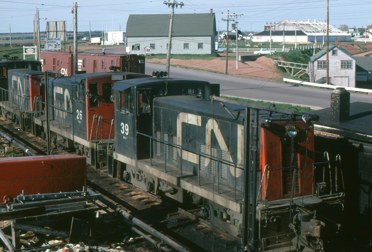Three GE 70 ton units are in close quarters at the ferry dock in Port Borden PEI on this June 1, 1968.
These are 600 hp class ER-6, with a max. speed of 55 mph. CN had 16 of them.