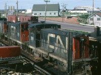 Three GE 70 ton units are in close quarters at the ferry dock in Port Borden PEI on this June 1, 1968.
These are 600 hp class ER-6, with a max. speed of 55 mph. CN had 16 of them.