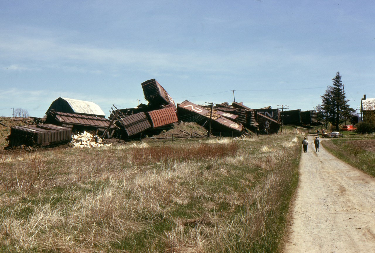 Here is the west to east view of the CN derailment at Bowmanville May 19, 1974. The folks in the house at the right must have found this affair a little disconcerting.  The house was torn down just a few weeks ago (Sept. 2016)  to make way for a new housing development.
