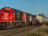 On the West end of Port Hope, CN 149 roars through the Haskill Rd crossing with a fresh SD60 on point.

CN 5476, CN 2415, CN 5714

1710hrs