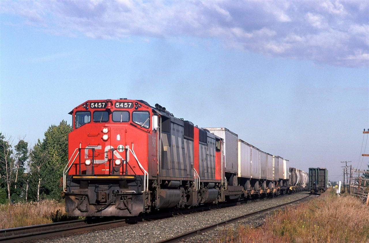 A westbound mixed train, likely #217 or 219, runs along the Brenmar siding, just east of Edmonton. It was a short siding, that has long since been removed.