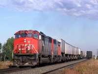 A westbound mixed train, likely #217 or 219, runs along the Brenmar siding, just east of Edmonton. It was a short siding, that has long since been removed.