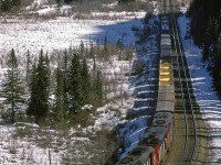 A very short and highly overpowered westbound manifest train has just left Jasper and is at the standard photo location of Geikie. 