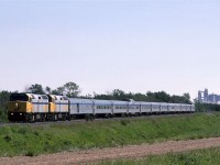 VIA's westbound "Canadian" leaves Edmonton, just west of Bissel Yard. The graded dirt area will be a shoe-fly in the coming months as a bridge is built for the tracks. Anthony Henday Drive will soon come through here.