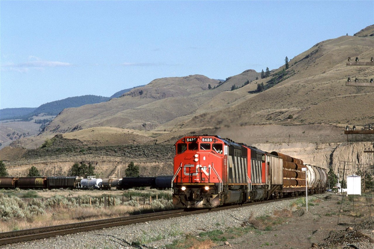 This is a westbound at Juniper Beach Provincial Park.
CP's line can be see with the poles above the train on the bank over the river.