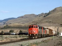 This is a westbound at Juniper Beach Provincial Park.
CP's line can be see with the poles above the train on the bank over the river.