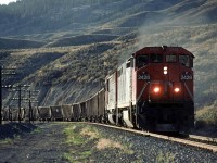 An eastbound empty coal train comes around a corner just east of the McAbee siding and Gravel pit.
The Trans Canada Highway may be seen well above the train.