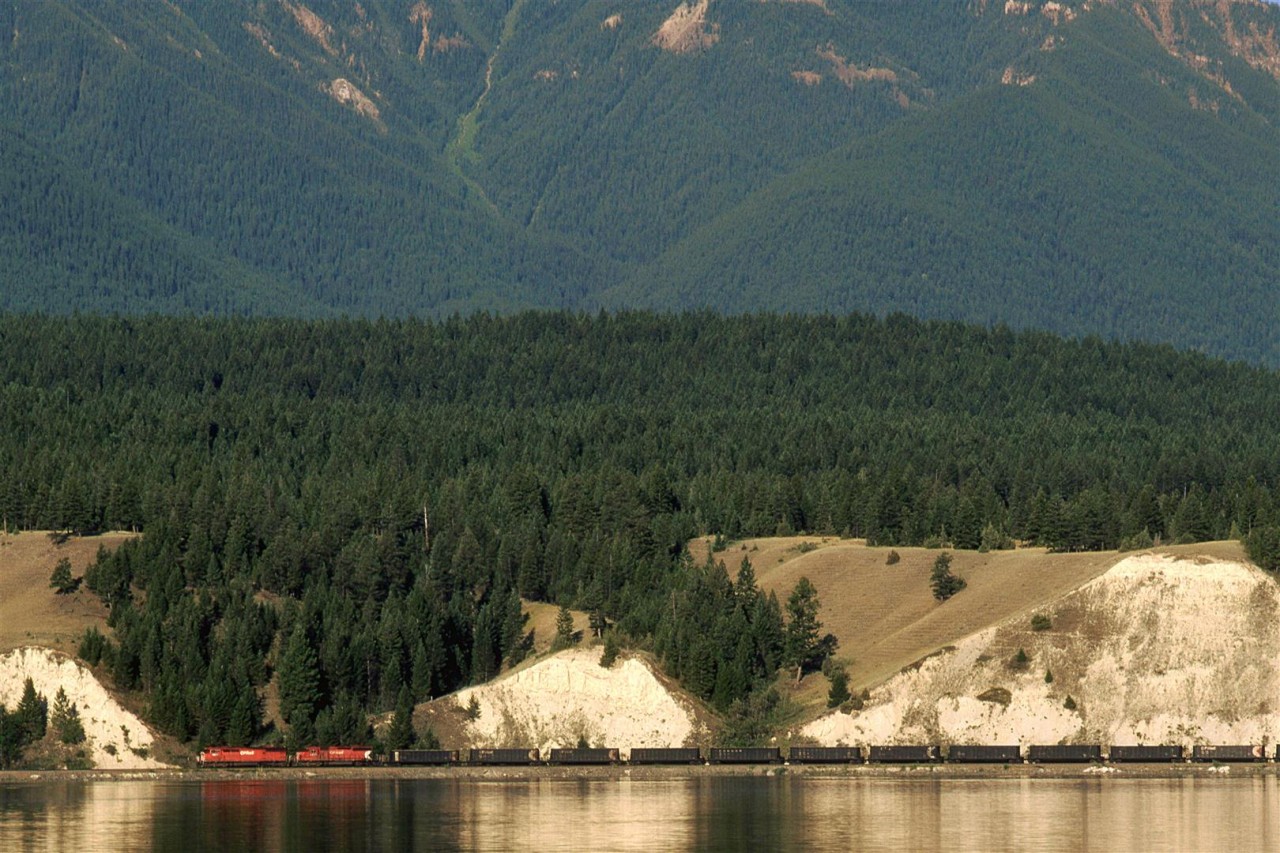 An eastbound empty coal train returns to the mines of south eastern BC. It is travelling along Windermere Lake.