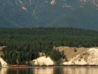 An eastbound empty coal train returns to the mines of south eastern BC. It is travelling along Windermere Lake.