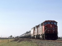 This is what I remember train #218 to be - high revenue chemical traffic, and auto traffic (not visible in this photo), with new high horsepower engines. It wasn't CN's hottest train, but it may have been their most lucrative.
In spite of it being on the east side of Edmonton, and heading east, it is not leaving town. It will conduct business at Clover Bar Yard, which was on the extreme eastern edge of town at the time.

